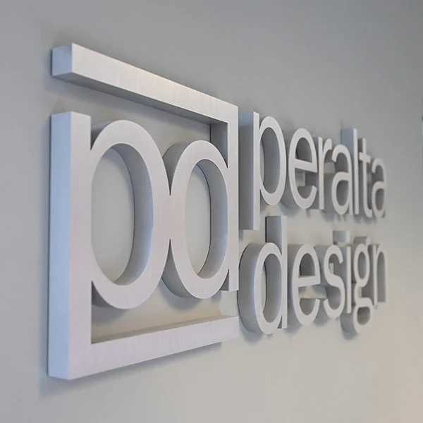 peralta design metal sign on gray wall